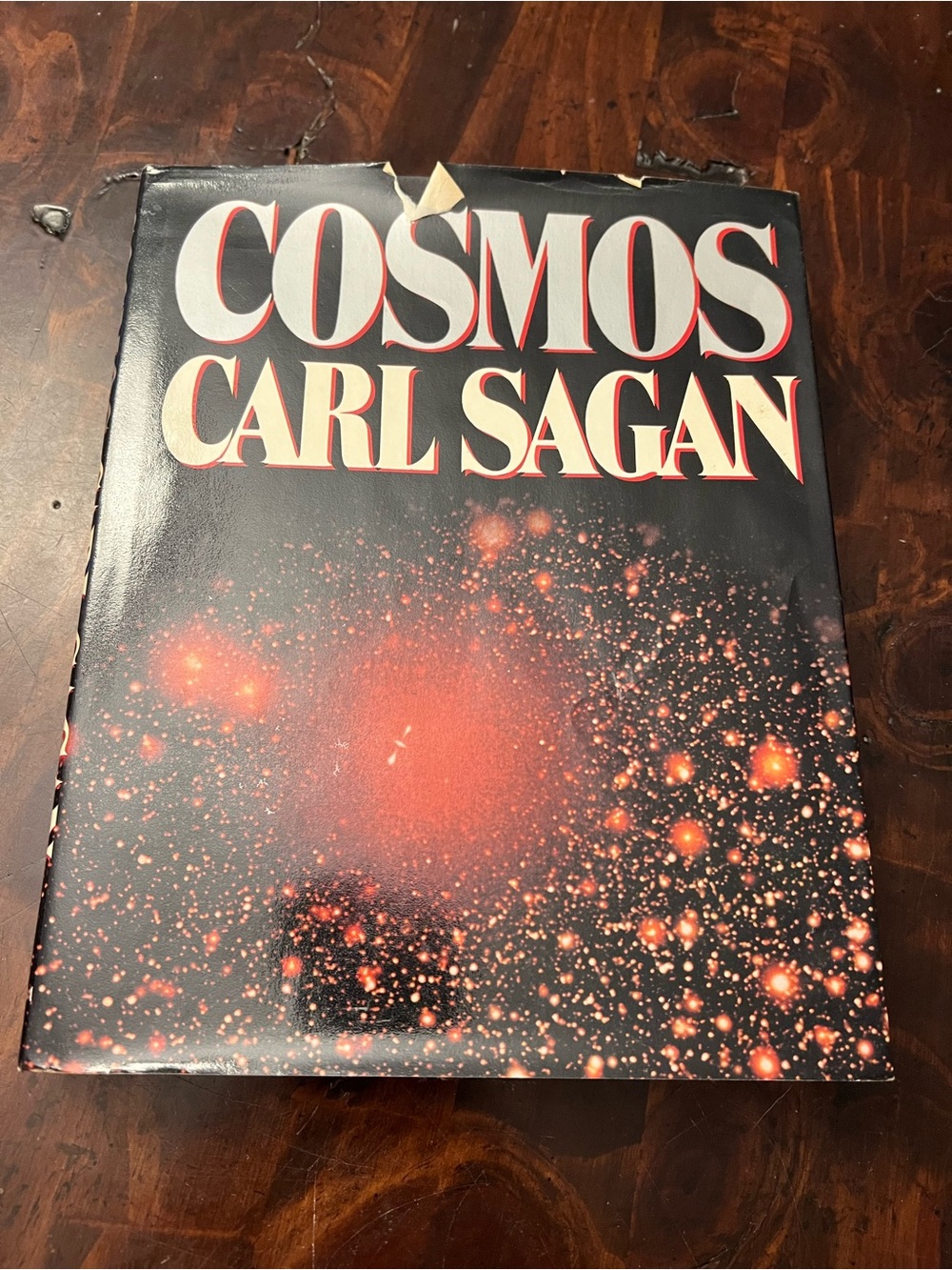 Cosmos by Carl Sagan - Black Cover with Red/Orange Starfield